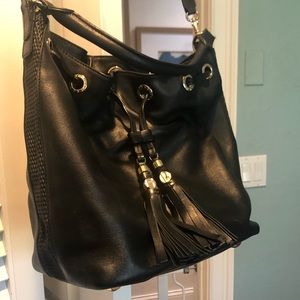 Henri bendel black bucket bag with hold hardware.